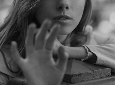 Silhouette of a person in a balance pose against a light background.